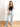 Model is wearing a black high neck crop tank.
