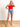 Model is wearing a red high neck crop tank.